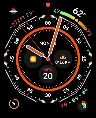 Auto-generated description: A smartwatch display shows the time, date, weather, temperature, and activity rings in vibrant colors.